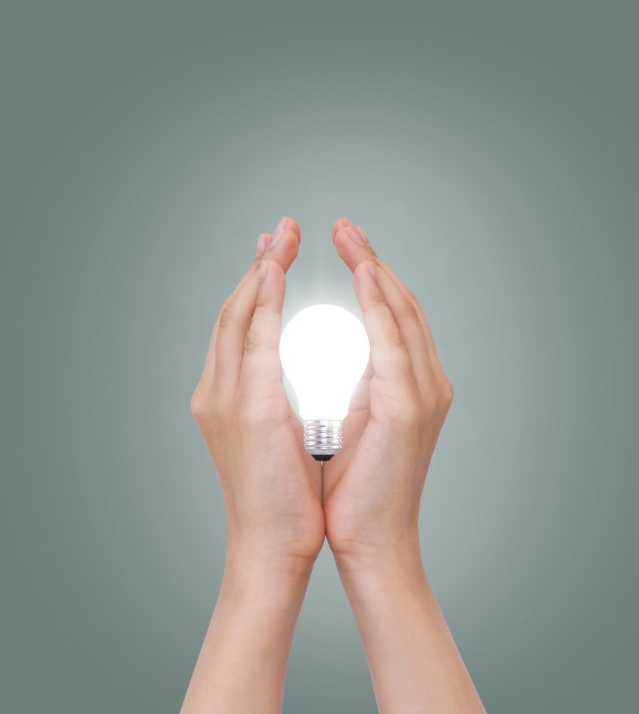 women hand with light bulb